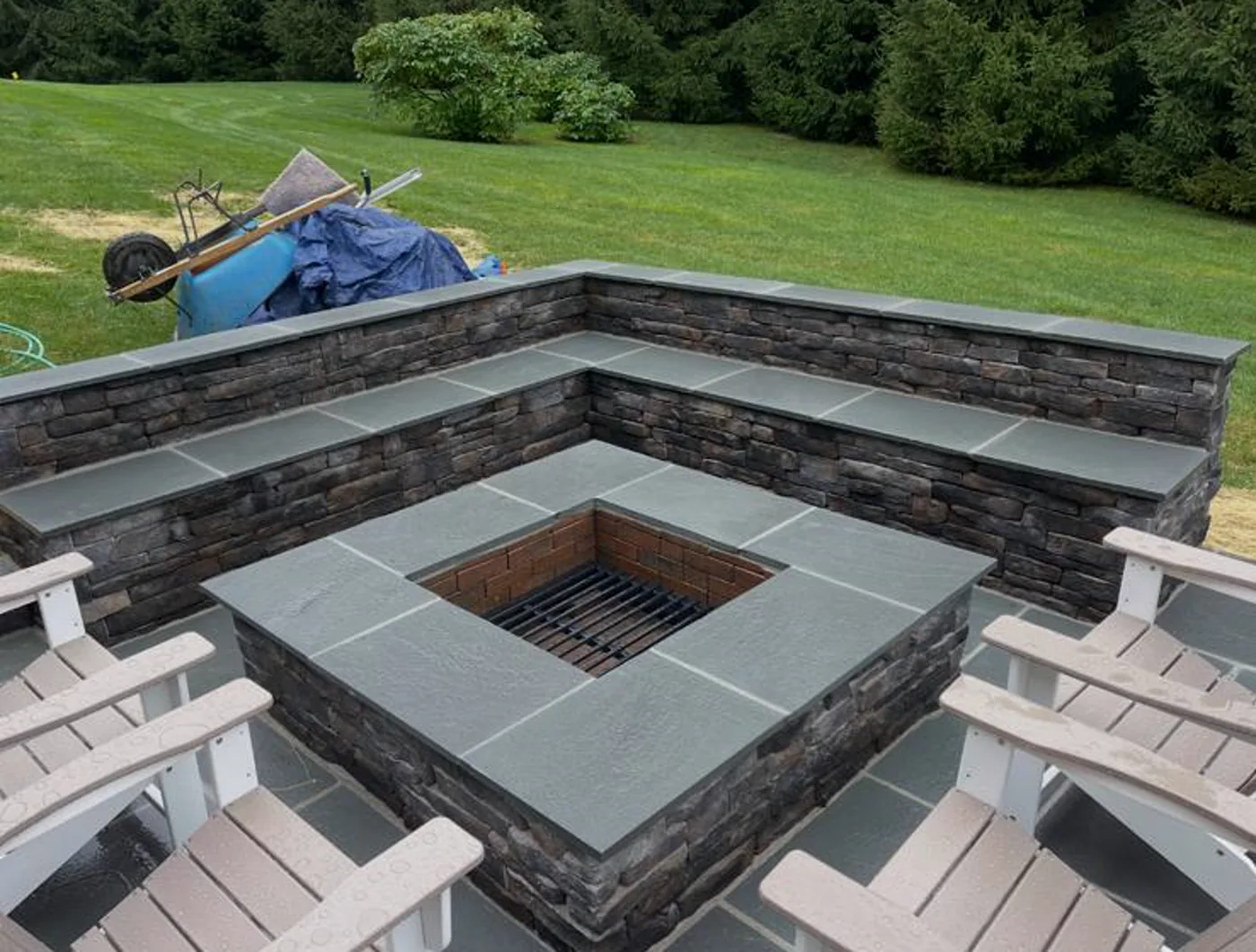 Stone firepit patio with seating wall